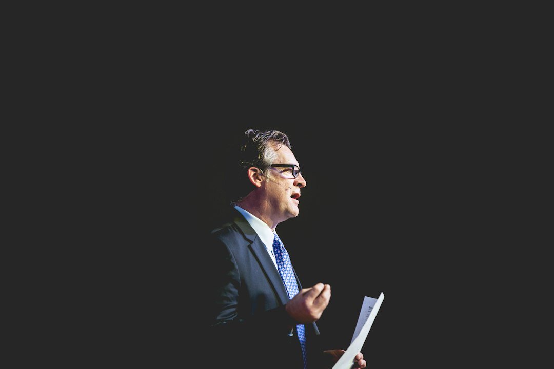 politician speaking on stage