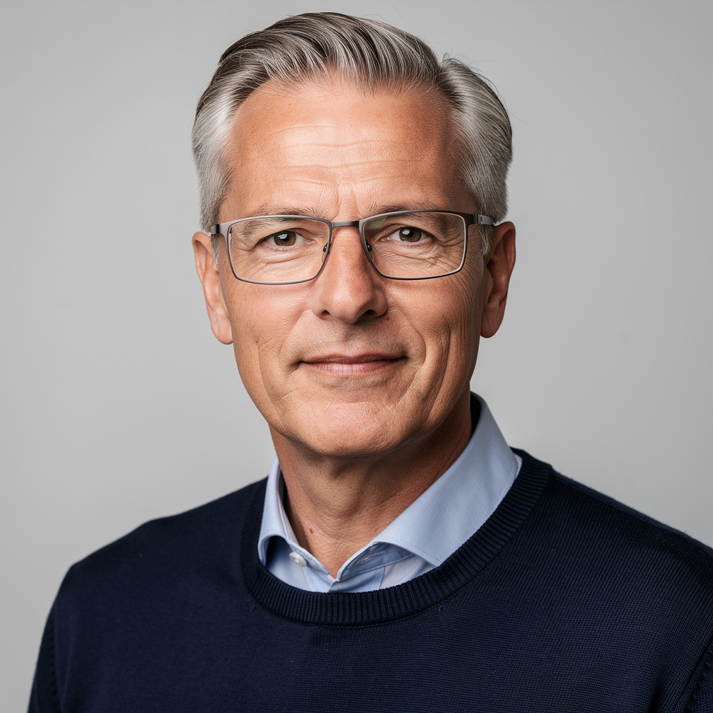 Studio portrait of a German male statistician with glasses