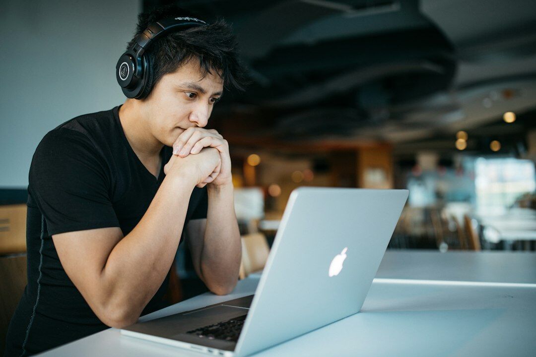 person looking worried at laptop